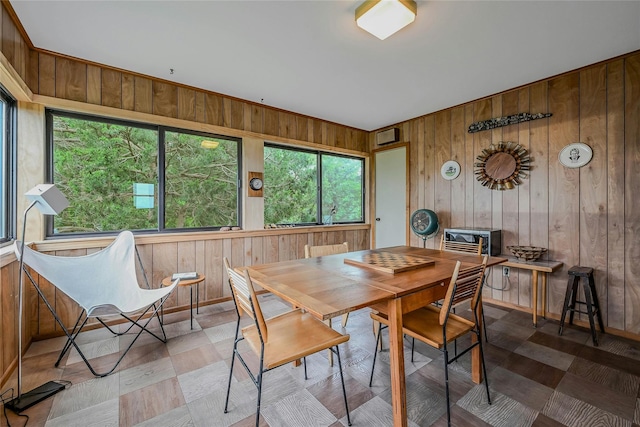 103 Harbor Beach Rd, Miller Place, NY 11764 - dining area featuring wooden walls and healthy amount of natural light
