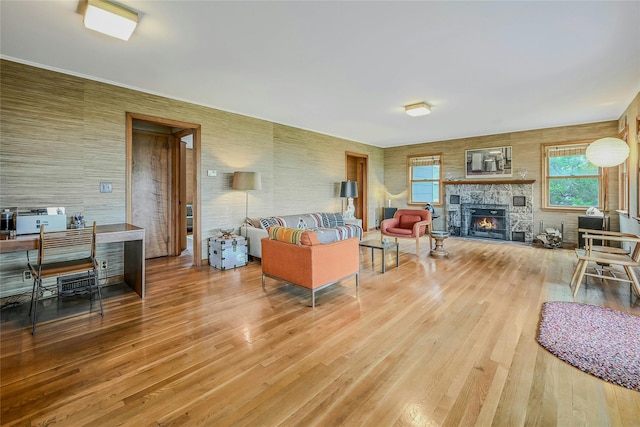 103 Harbor Beach Rd, Miller Place, NY 11764 - living room featuring wood finished floors and a stone fireplace