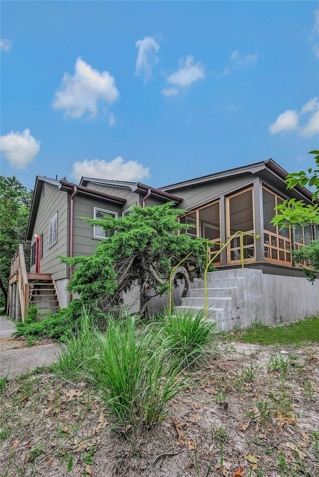 103 Harbor Beach Rd, Miller Place, NY 11764 - view of side of home with a sunroom and stairs
