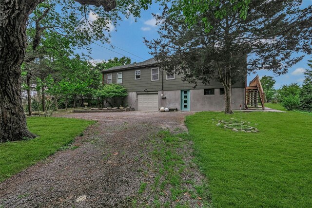 103 Harbor Beach Rd, Miller Place, NY 11764 - view of front facade with driveway, stairs, a garage, and a front yard