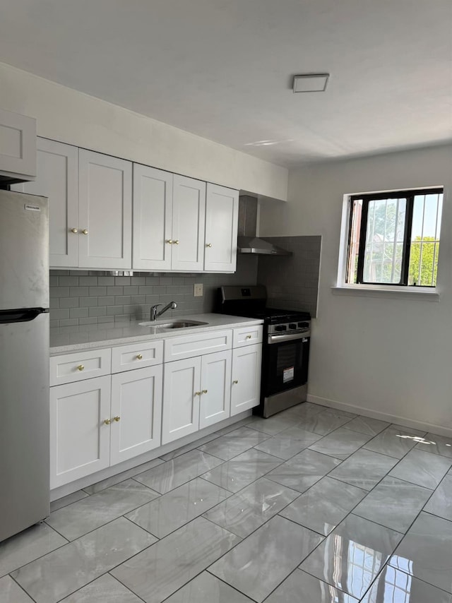 1811 123rd St Unit 4F, College Point, NY 11356 - kitchen featuring stainless steel appliances, wall chimney exhaust hood, light marble finish floors, light countertops, and decorative backsplash