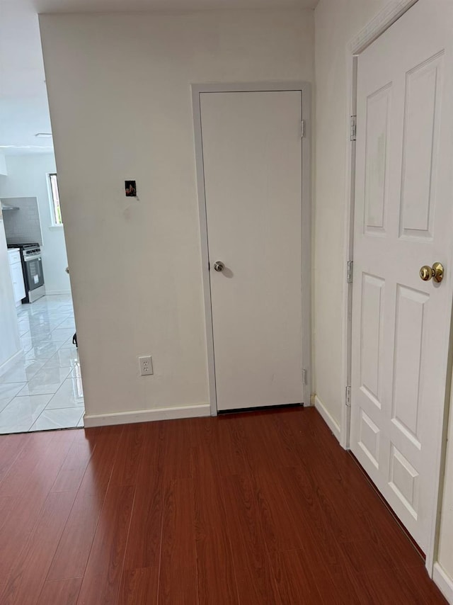1811 123rd St Unit 4F, College Point, NY 11356 - unfurnished bedroom with wood finished floors and baseboards