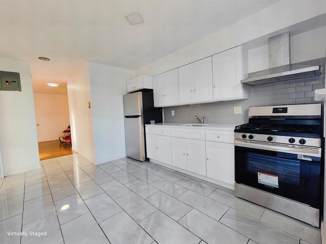 1811 123rd St Unit 4F, College Point, NY 11356 - kitchen featuring appliances with stainless steel finishes, wall chimney exhaust hood, light countertops, tasteful backsplash, and white cabinetry