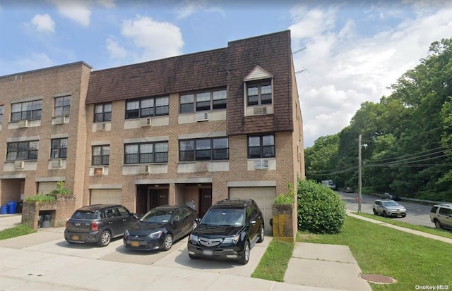 240-02 70th Ave Unit 1C, Douglaston, NY 11362 - view of property with driveway and a garage