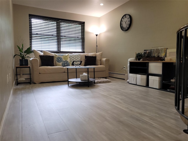 240-02 70th Ave Unit 1C, Douglaston, NY 11362 - living area with a baseboard radiator and wood finished floors