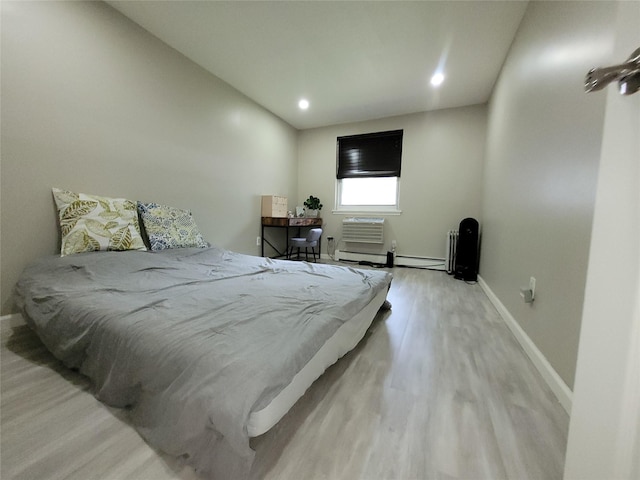 240-02 70th Ave Unit 1C, Douglaston, NY 11362 - bedroom featuring wood finished floors, recessed lighting, and a wall unit AC