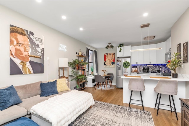 160-15 Powells Cove Blvd Unit B103, Beechhurst, NY 11357 - living room featuring light wood finished floors and recessed lighting