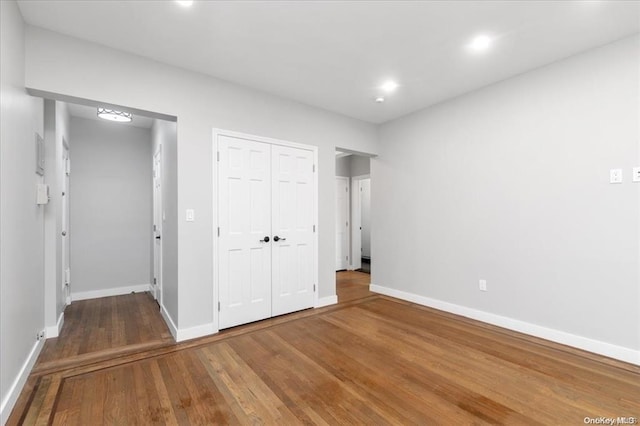 160-15 Powells Cove Blvd Unit B103, Beechhurst, NY 11357 - unfurnished bedroom featuring wood finished floors, a closet, and recessed lighting