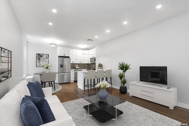 160-15 Powells Cove Blvd Unit B103, Beechhurst, NY 11357 - living room featuring dark wood-style flooring and recessed lighting