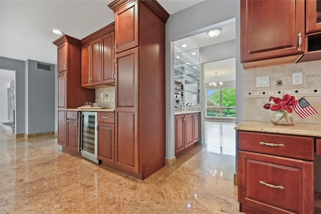 94 Hirst Rd, Briarcliff Manor, NY 10510 - kitchen featuring wine cooler, decorative backsplash, light stone countertops, light marble finish floors, and recessed lighting