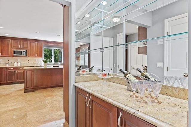 94 Hirst Rd, Briarcliff Manor, NY 10510 - bar with stainless steel microwave, recessed lighting, light tile patterned flooring, and decorative backsplash
