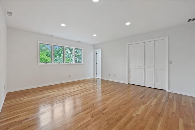 94 Hirst Rd, Briarcliff Manor, NY 10510 - unfurnished bedroom featuring light wood finished floors, recessed lighting, and a closet