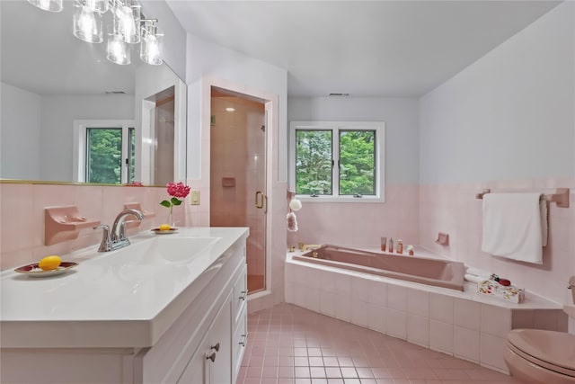 94 Hirst Rd, Briarcliff Manor, NY 10510 - full bath with vanity, a bath, tile patterned floors, a stall shower, and tile walls