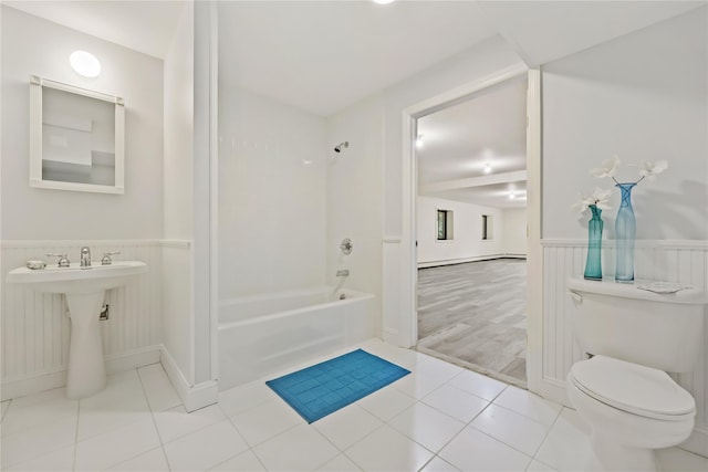 94 Hirst Rd, Briarcliff Manor, NY 10510 - bathroom with  shower combination, tile patterned flooring, and a wainscoted wall