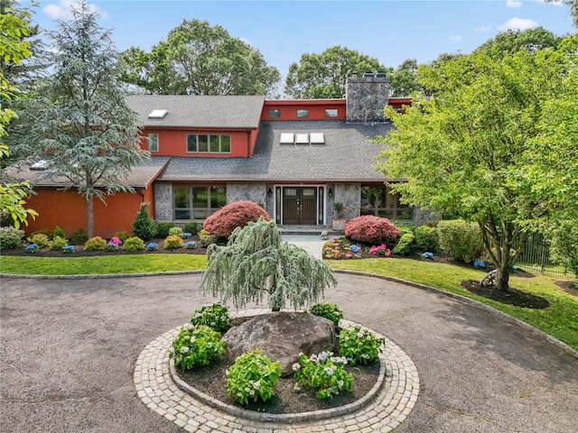 94 Hirst Rd, Briarcliff Manor, NY 10510 - mid-century modern home featuring roof with shingles, curved driveway, and stone siding