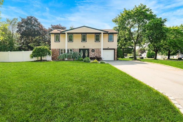 27 Dorchester Rd, Smithtown, NY 11787 - view of front of house featuring brick siding, driveway, and a garage