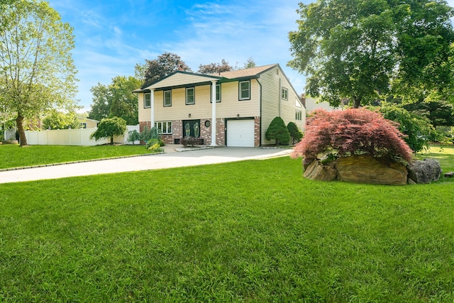 27 Dorchester Rd, Smithtown, NY 11787 - view of front facade featuring concrete driveway, an attached garage, and brick siding