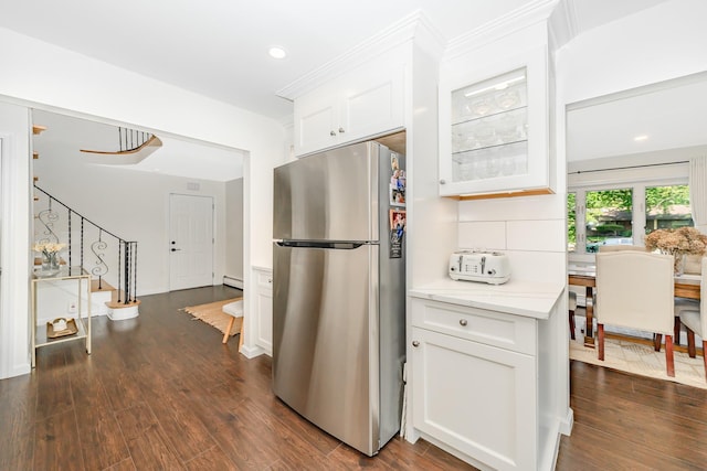 27 Dorchester Rd, Smithtown, NY 11787 - kitchen featuring freestanding refrigerator, white cabinetry, dark wood-style floors, backsplash, and recessed lighting