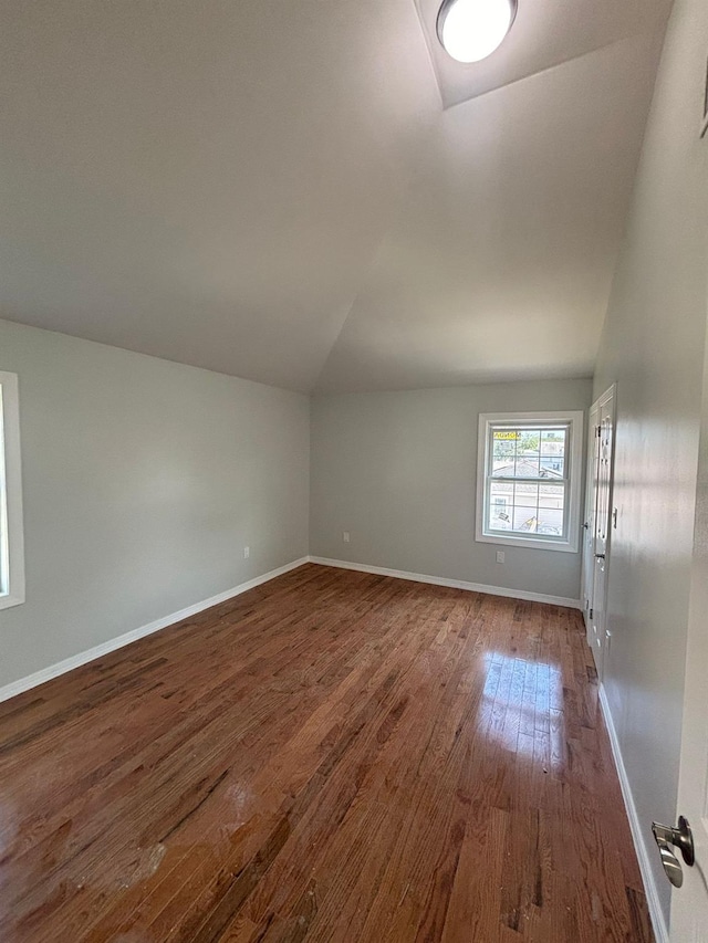 167-12 110th Ave, Jamaica, NY 11433 - unfurnished room featuring vaulted ceiling and dark wood-type flooring