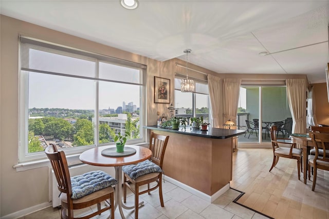 300 High Point Dr Unit 711, Hartsdale, NY 10530 - dining room featuring a chandelier and a city view