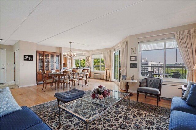 300 High Point Dr Unit 711, Hartsdale, NY 10530 - living area with a chandelier and light wood-type flooring