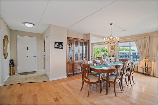 300 High Point Dr Unit 711, Hartsdale, NY 10530 - dining room featuring light wood-style floors and a chandelier
