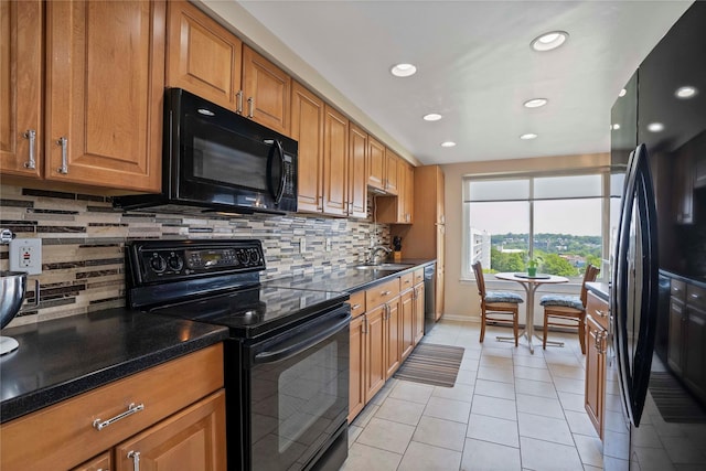 300 High Point Dr Unit 711, Hartsdale, NY 10530 - kitchen with black appliances, light tile patterned floors, recessed lighting, backsplash, and brown cabinets