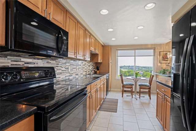 300 High Point Dr Unit 711, Hartsdale, NY 10530 - kitchen with black appliances, backsplash, brown cabinets, light tile patterned floors, and recessed lighting