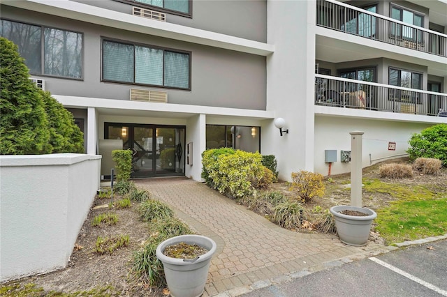 300 High Point Dr Unit 711, Hartsdale, NY 10530 - property entrance with stucco siding and french doors