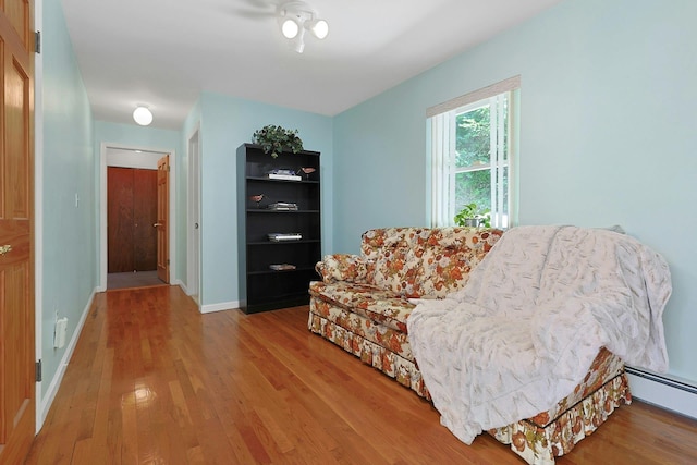 49 Nanny Hagen Rd, Thornwood, NY 10594 - living area with wood finished floors and a baseboard radiator