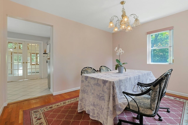 49 Nanny Hagen Rd, Thornwood, NY 10594 - dining space with wood finished floors, a chandelier, and french doors