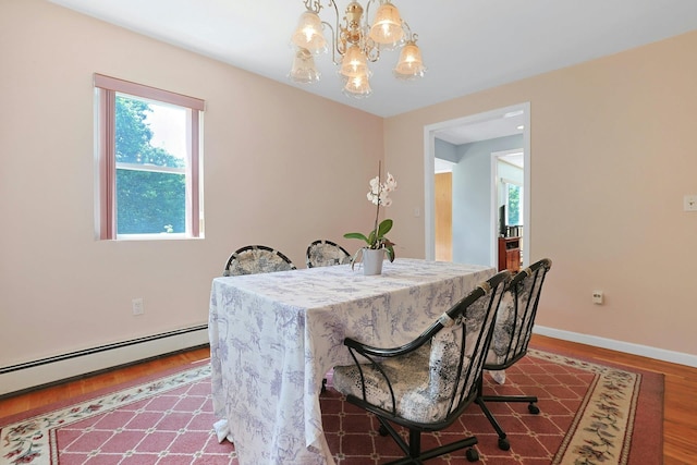 49 Nanny Hagen Rd, Thornwood, NY 10594 - dining room with a chandelier, wood finished floors, and baseboard heating
