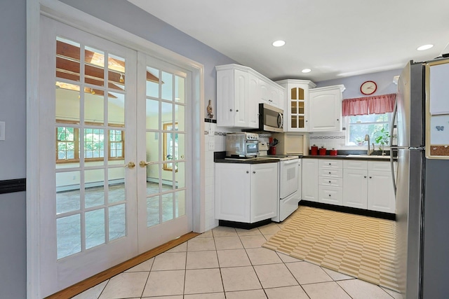 49 Nanny Hagen Rd, Thornwood, NY 10594 - kitchen with stainless steel appliances, french doors, healthy amount of natural light, dark countertops, and recessed lighting