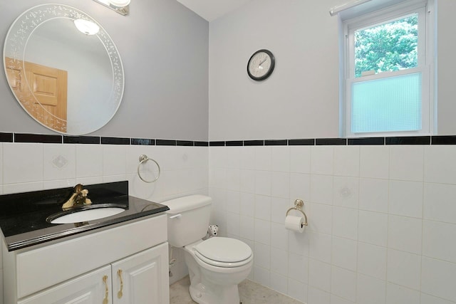 49 Nanny Hagen Rd, Thornwood, NY 10594 - bathroom featuring vanity, tile walls, and wainscoting
