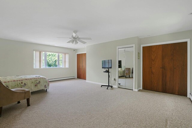 49 Nanny Hagen Rd, Thornwood, NY 10594 - carpeted bedroom featuring baseboard heating, multiple closets, and ceiling fan