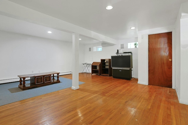 49 Nanny Hagen Rd, Thornwood, NY 10594 - below grade area with light wood-style flooring, a baseboard heating unit, and recessed lighting