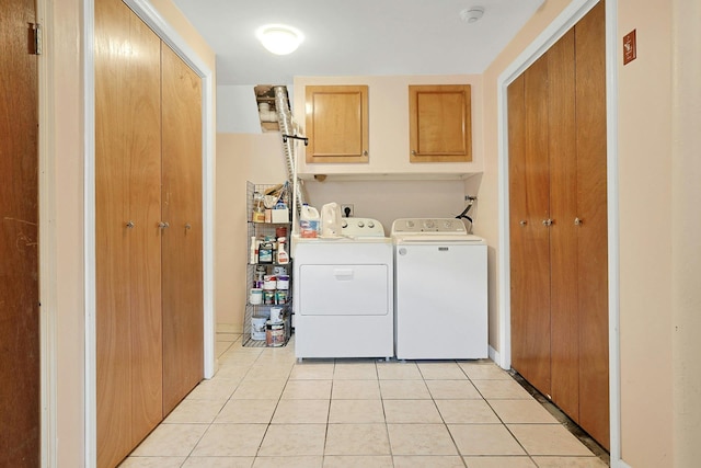 49 Nanny Hagen Rd, Thornwood, NY 10594 - laundry room with washer and clothes dryer, cabinet space, and light tile patterned floors