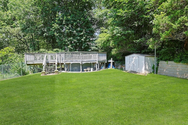 49 Nanny Hagen Rd, Thornwood, NY 10594 - view of yard featuring a wooden deck, a storage unit, and stairs