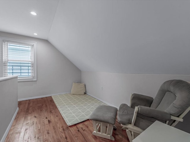 71 Van Nostrand Ave, North Merrick, NY 11566 - living area with vaulted ceiling, wood finished floors, and recessed lighting