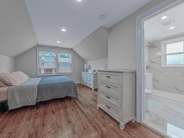 71 Van Nostrand Ave, North Merrick, NY 11566 - bedroom with multiple windows, wood finished floors, connected bathroom, lofted ceiling, and recessed lighting