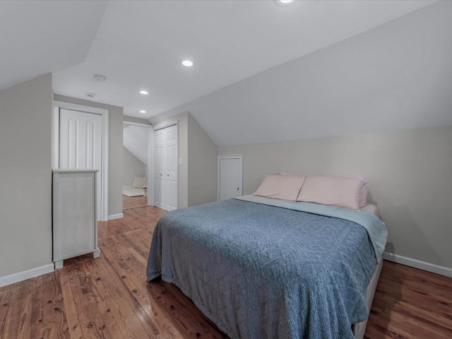 71 Van Nostrand Ave, North Merrick, NY 11566 - bedroom with lofted ceiling, wood finished floors, recessed lighting, and a closet