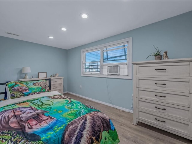 71 Van Nostrand Ave, North Merrick, NY 11566 - bedroom with light wood finished floors, recessed lighting, and cooling unit