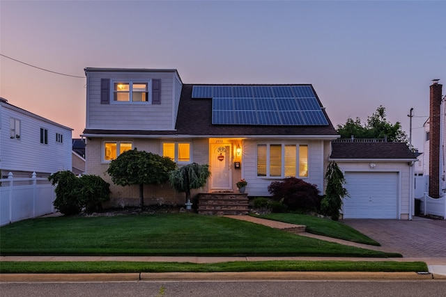 2953 Bluepoint Ct, Wantagh, NY 11793 - view of front of property featuring roof mounted solar panels, a garage, decorative driveway, and a shingled roof