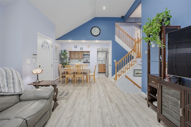 2953 Bluepoint Ct, Wantagh, NY 11793 - living area featuring stairway, lofted ceiling, and light wood finished floors