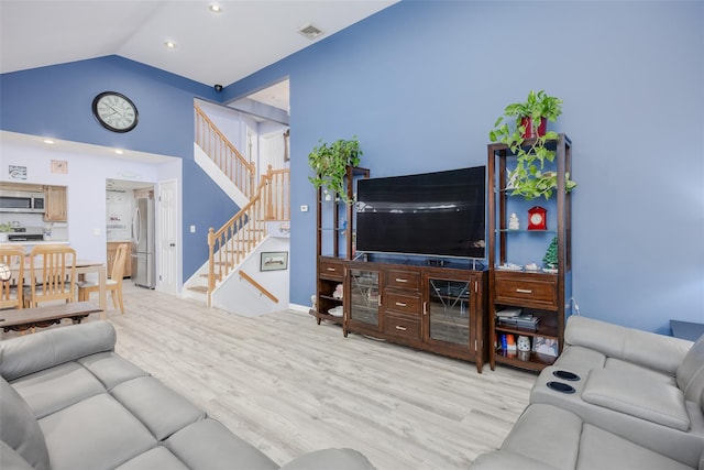 2953 Bluepoint Ct, Wantagh, NY 11793 - living area with light wood-style floors, stairs, lofted ceiling, and recessed lighting