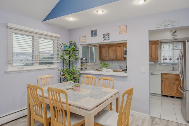 2953 Bluepoint Ct, Wantagh, NY 11793 - dining space featuring a baseboard radiator and baseboards