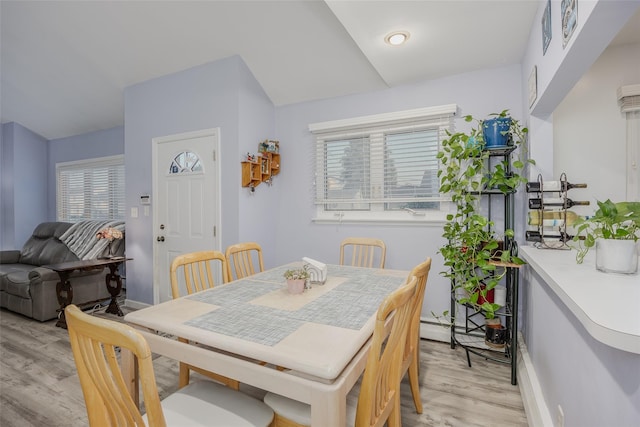 2953 Bluepoint Ct, Wantagh, NY 11793 - dining space with light wood-type flooring and lofted ceiling