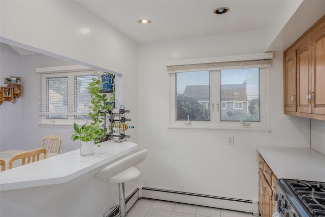 2953 Bluepoint Ct, Wantagh, NY 11793 - kitchen featuring a baseboard radiator, gas stove, healthy amount of natural light, light countertops, and recessed lighting