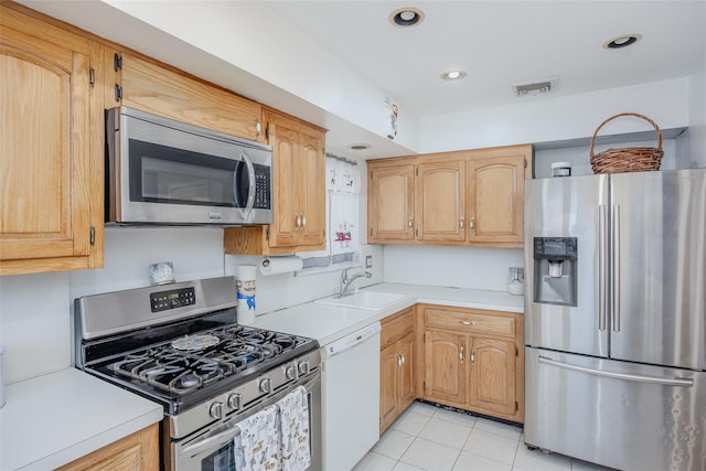 2953 Bluepoint Ct, Wantagh, NY 11793 - kitchen with appliances with stainless steel finishes, light countertops, light tile patterned floors, and recessed lighting