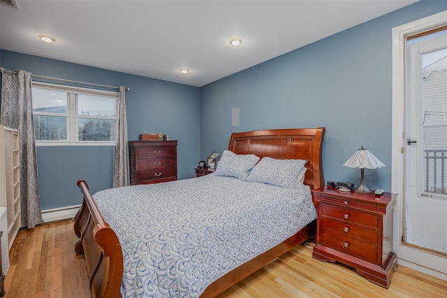 2953 Bluepoint Ct, Wantagh, NY 11793 - bedroom with wood finished floors, a baseboard radiator, and recessed lighting